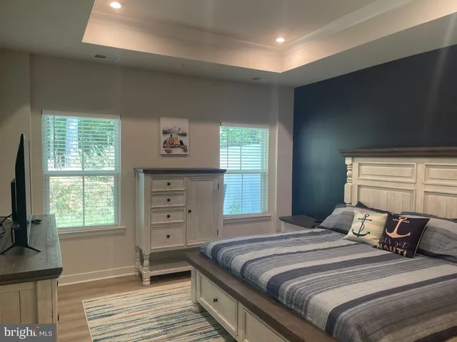 a kitchen with kitchen island a sink stainless steel appliances and cabinets
