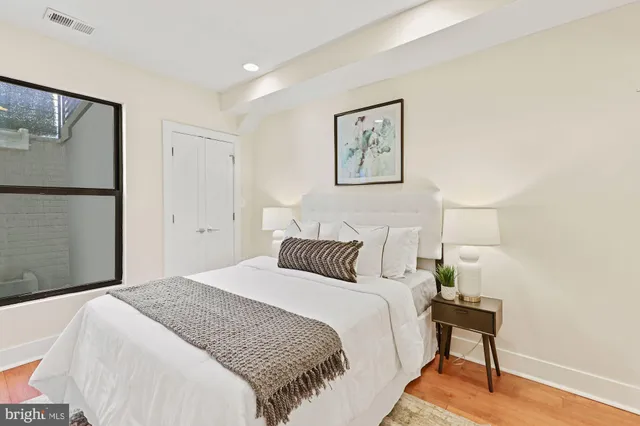 a bedroom with a bed and a table