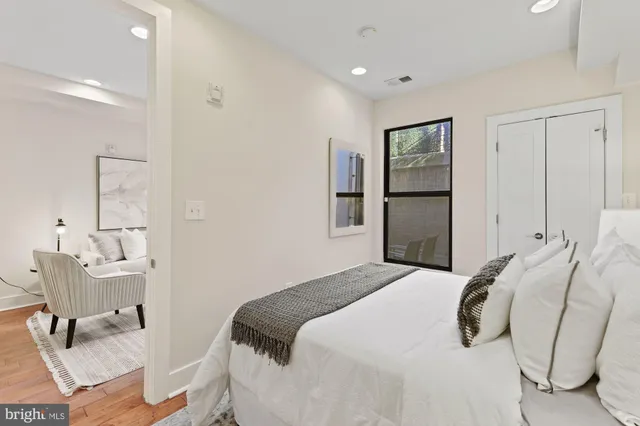 a bedroom with a bed and chair