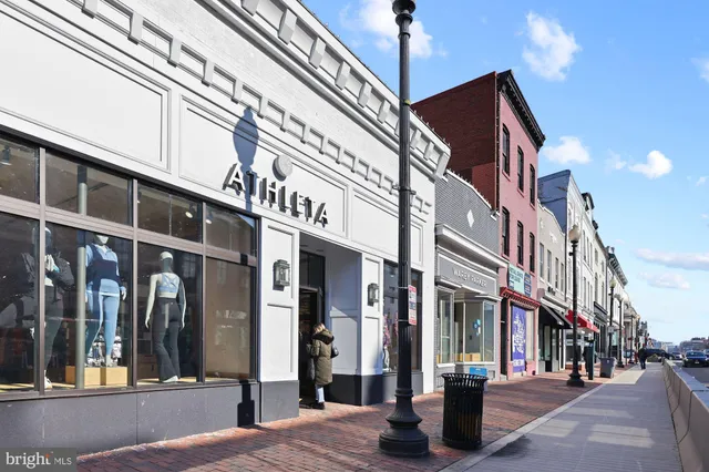 a view of path along with retail shop and buildings