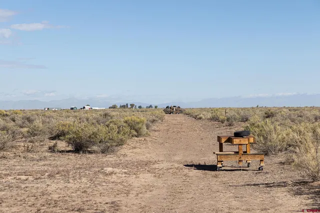 an aerial view of a houses with a beach