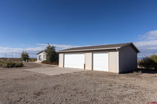 a view of empty room with a garage