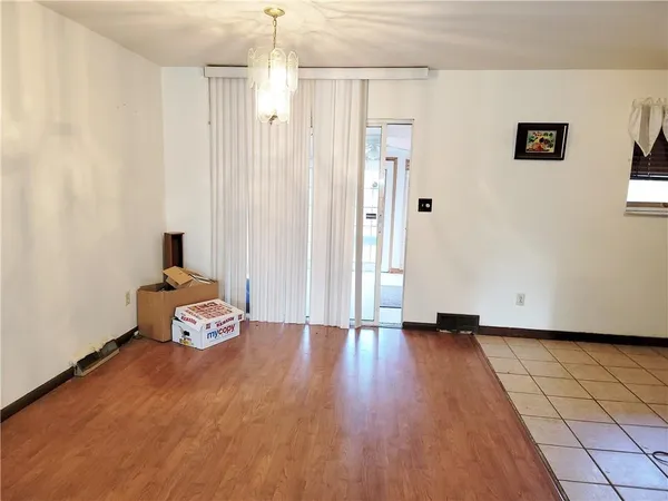 a view of a livingroom with wooden floor