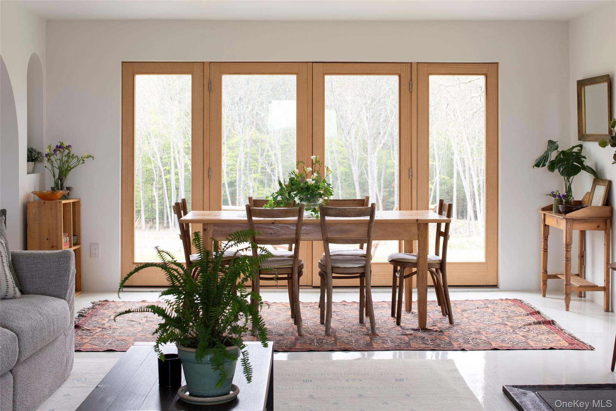 45 Charles Hommel Road Saugerties, NY 12477 - Photo 11 of 39 a dining room with furniture potted plants and wooden floor