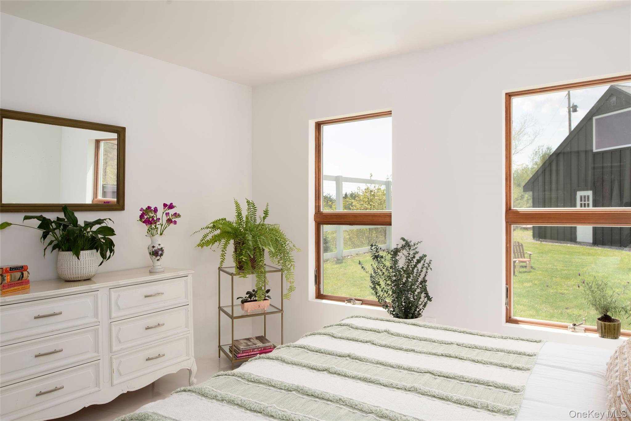 45 Charles Hommel Road Saugerties, NY 12477 - Photo 27 of 39 a bedroom with a bed potted plant and a window