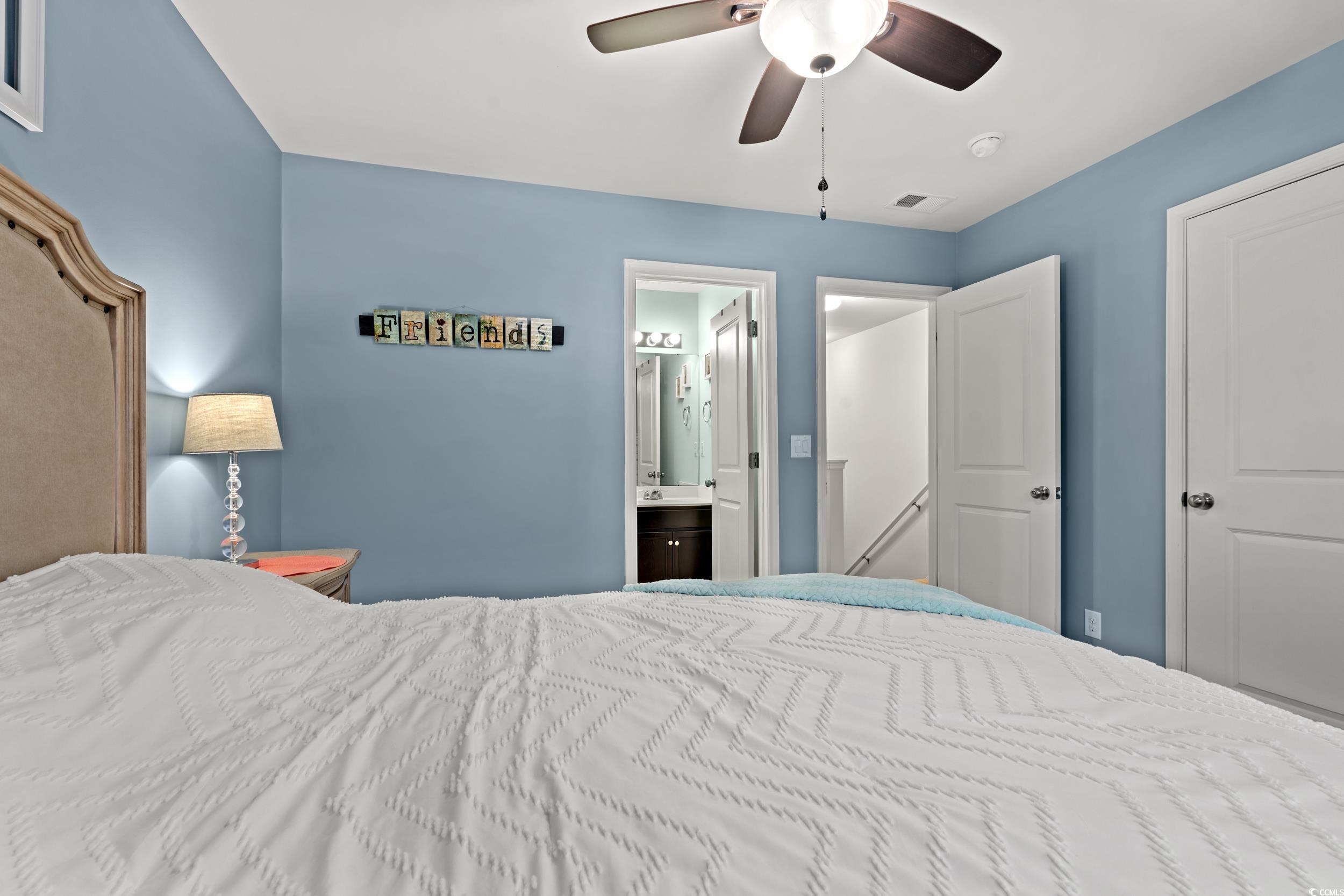 306 Castle Drive, Unit 306 Myrtle Beach, SC 29579 - Photo 18 of 30 Bedroom featuring a ceiling fan and ensuite bath