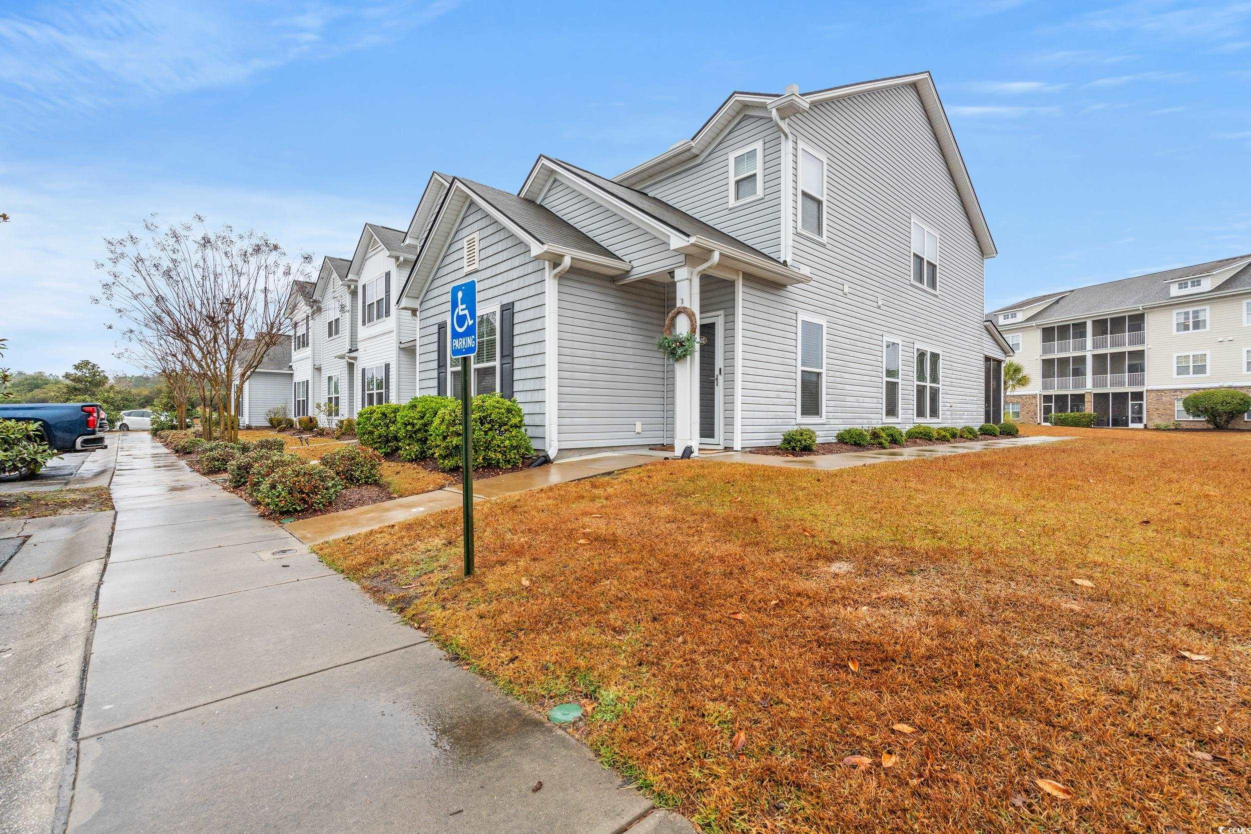 306 Castle Drive, Unit 306 Myrtle Beach, SC 29579 - Photo 23 of 30 View of front of home featuring a front lawn and a residential view