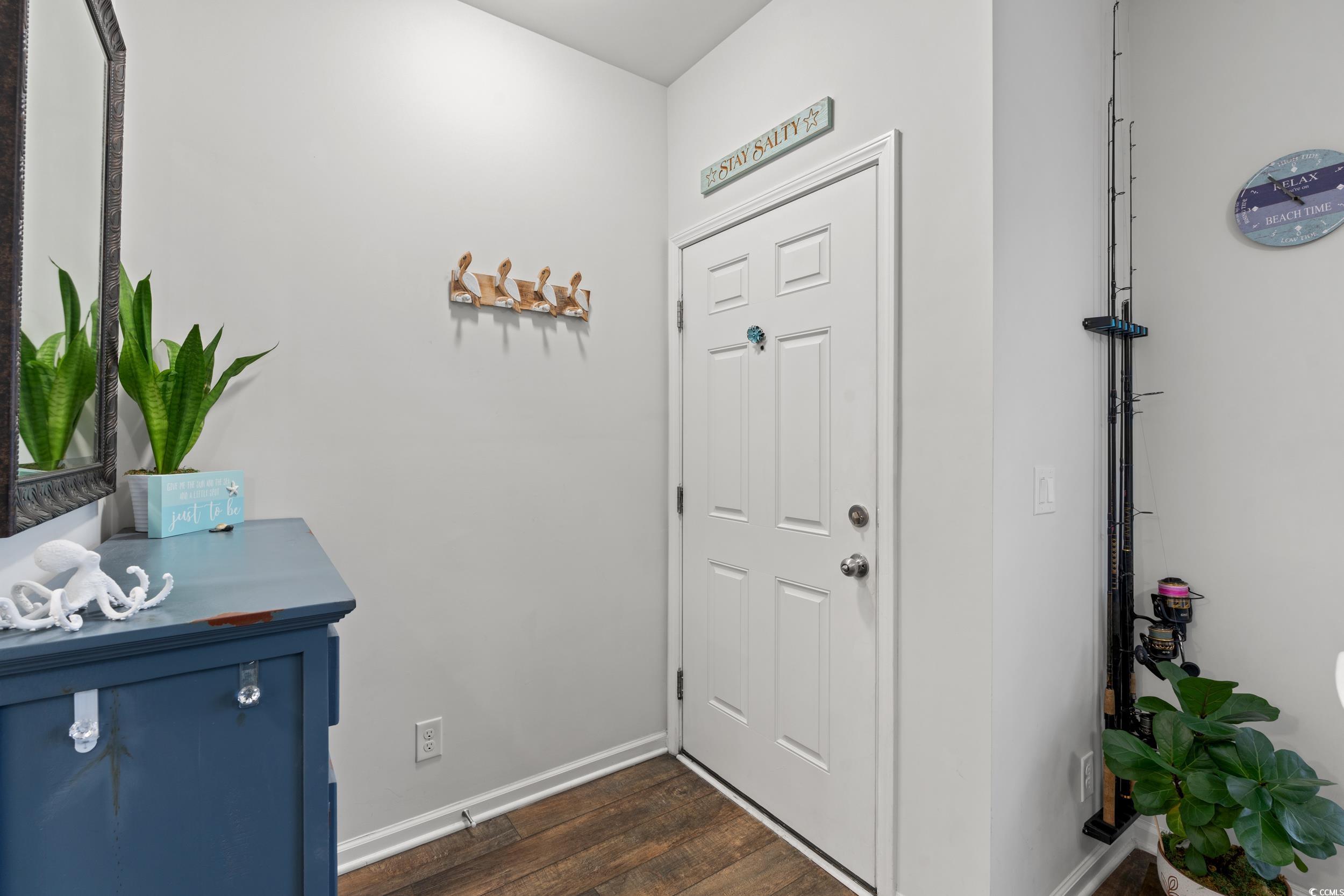 306 Castle Drive, Unit 306 Myrtle Beach, SC 29579 - Photo 3 of 30 Entryway with baseboards and dark wood finished floors