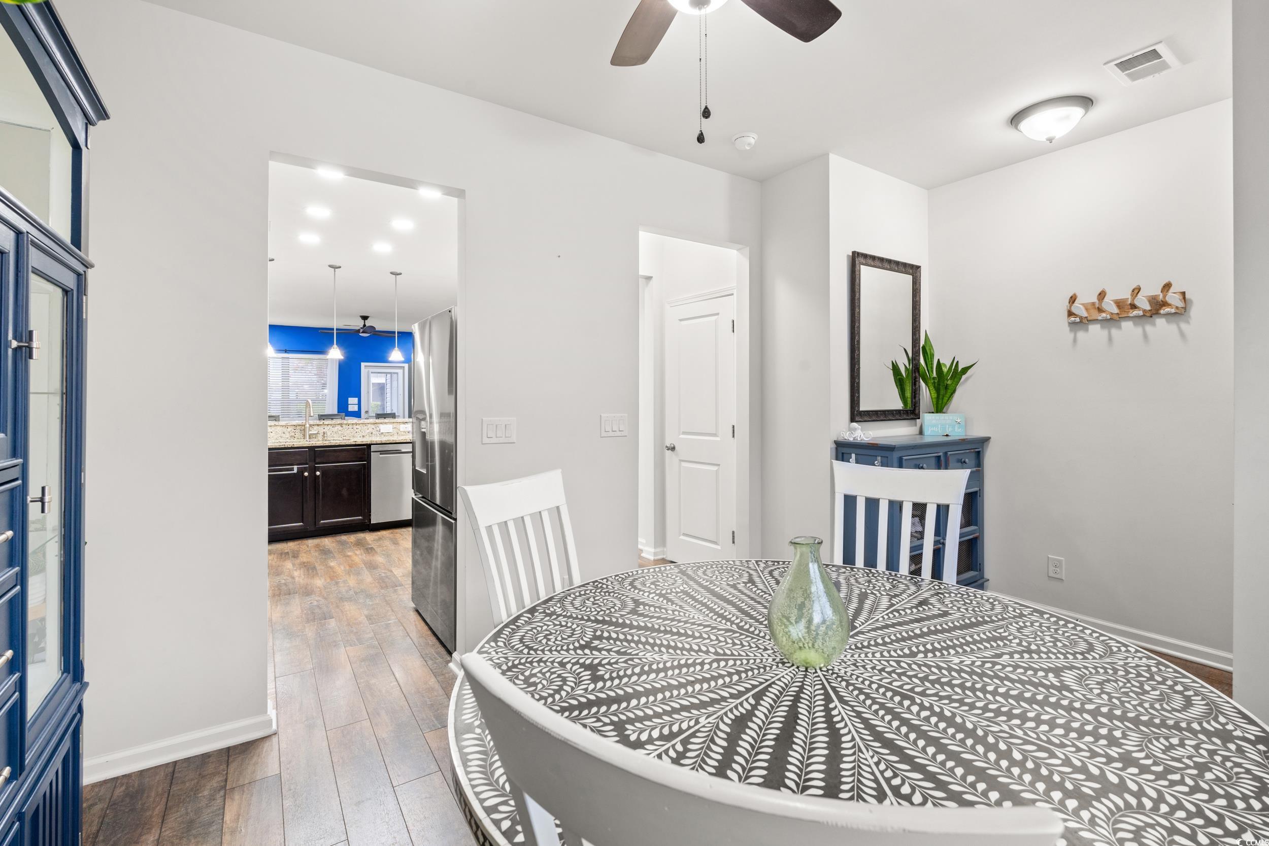 306 Castle Drive, Unit 306 Myrtle Beach, SC 29579 - Photo 8 of 30 Dining room with dark wood finished floors and a ceiling fan