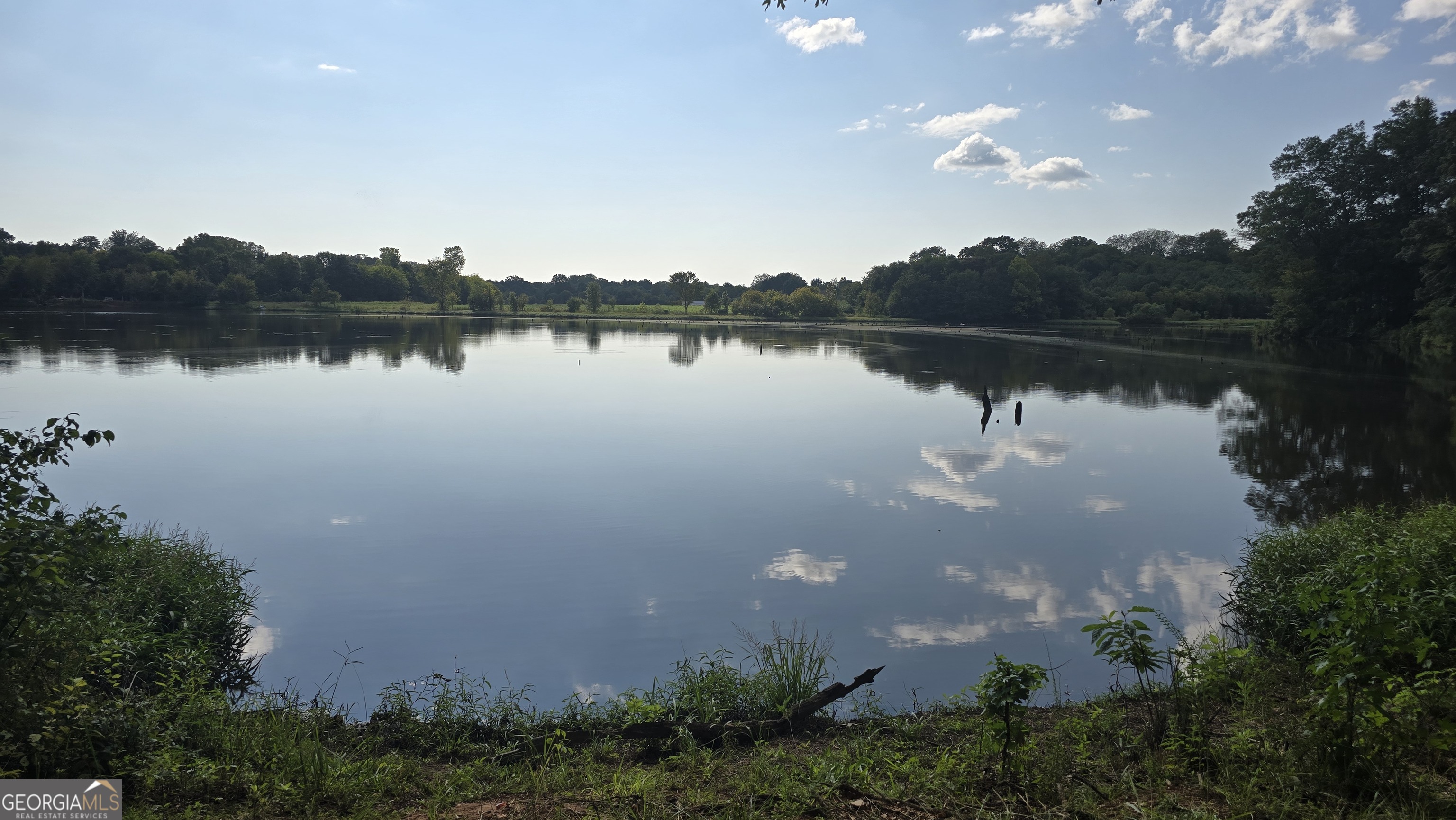 0 Wh Hayes Road Winder, GA 30680 - Photo 1 of 7 a view of a lake with houses in back