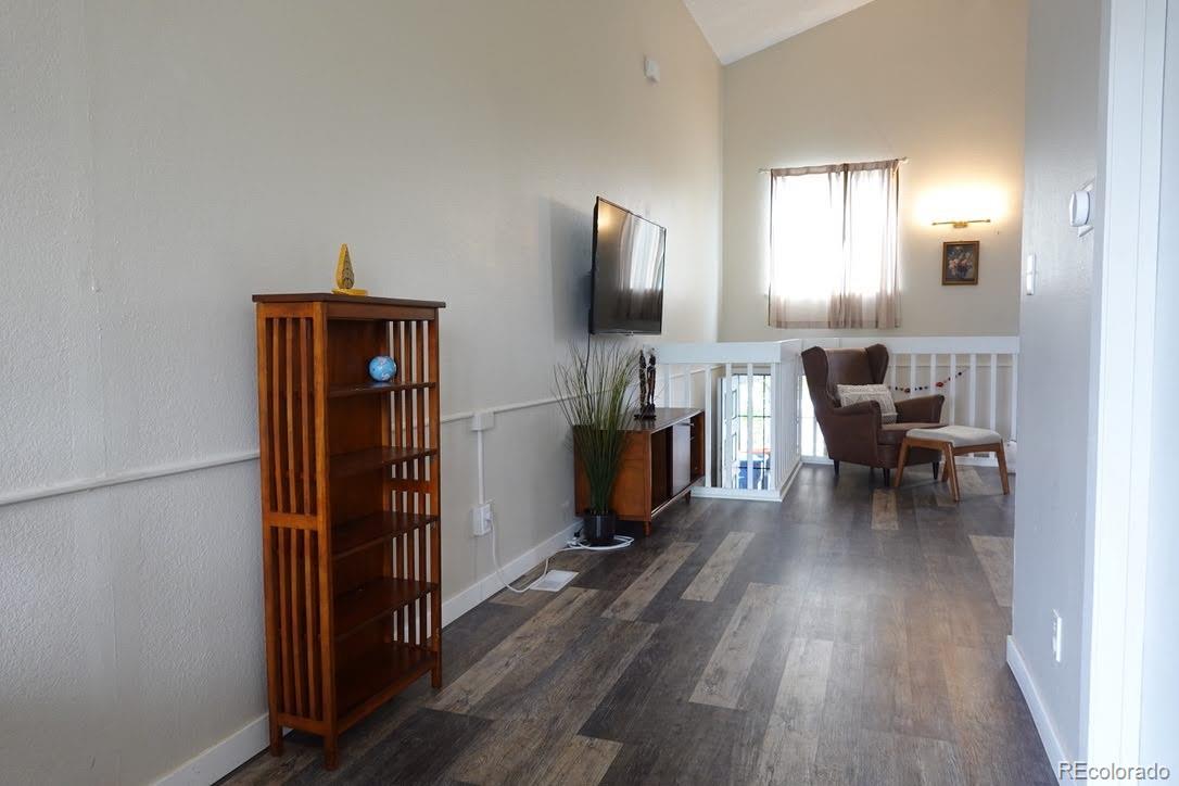 6057 Jay Street Arvada, CO 80003 - Photo 14 of 25 a living room with furniture and a flat screen tv