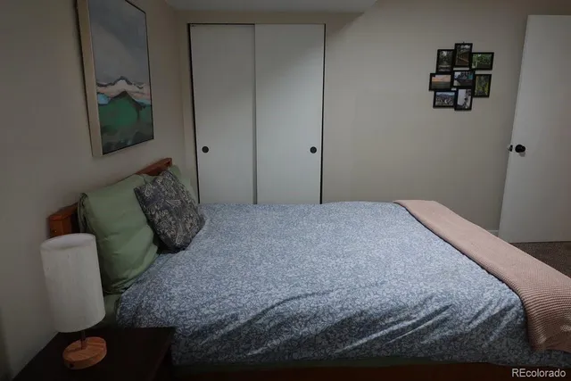 a bedroom with a bed and a television