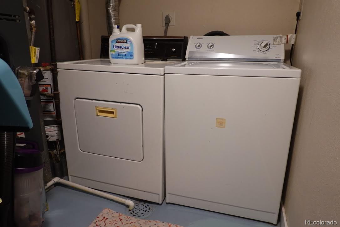 6057 Jay Street Arvada, CO 80003 - Photo 21 of 25 a utility room with dryer and washer
