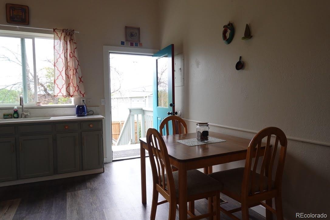 6057 Jay Street Arvada, CO 80003 - Photo 7 of 25 a dining room with furniture and window