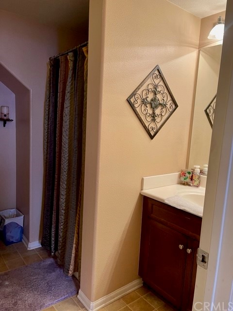 29839 Winter Hawk Road Menifee, CA 92586 - Photo 11 of 21 a bathroom with a sink and a mirror