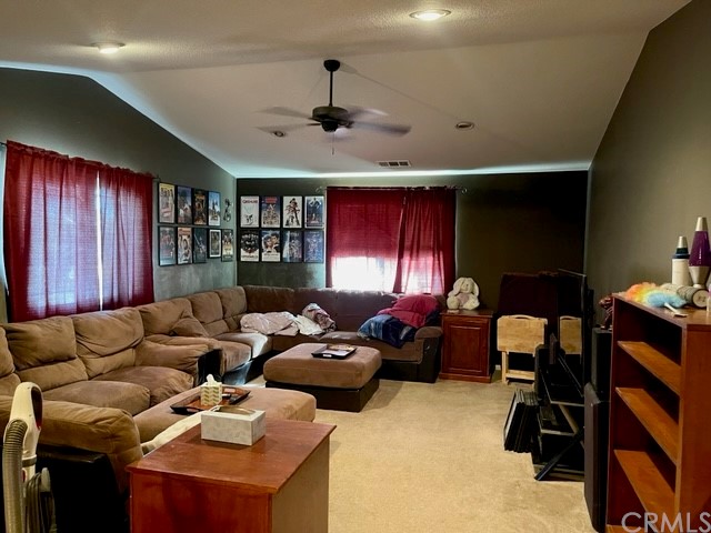 29839 Winter Hawk Road Menifee, CA 92586 - Photo 13 of 21 a living room with furniture fireplace and a window