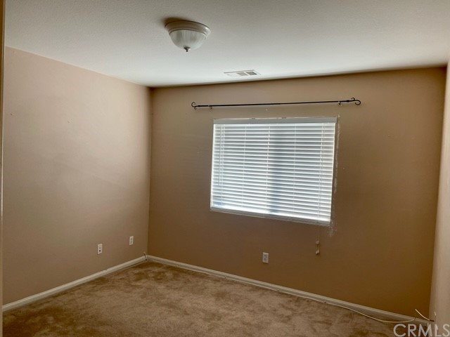 29839 Winter Hawk Road Menifee, CA 92586 - Photo 16 of 21 a view of an empty room with a window