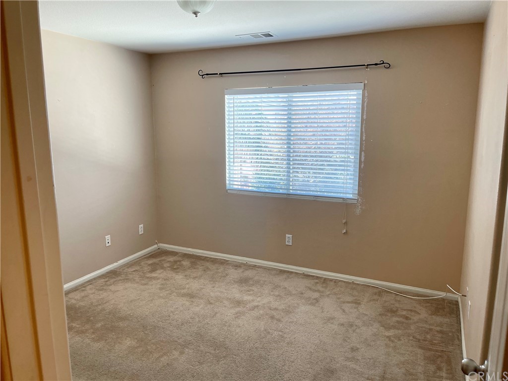 29839 Winter Hawk Road Menifee, CA 92586 - Photo 17 of 21 a view of an empty room with a window