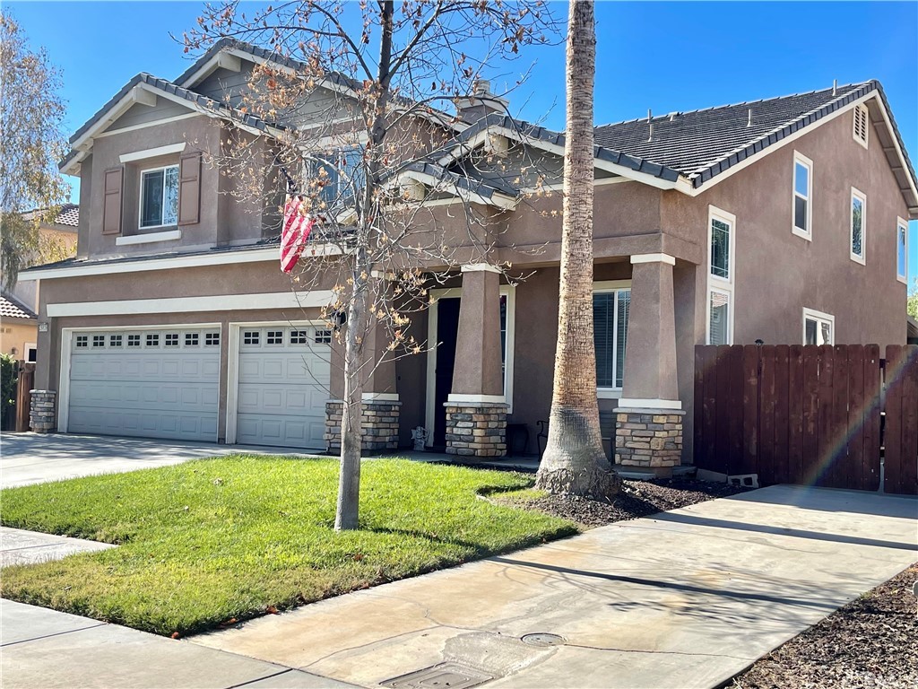 29839 Winter Hawk Road Menifee, CA 92586 - Photo 2 of 21 a view of a house with a yard and pathway