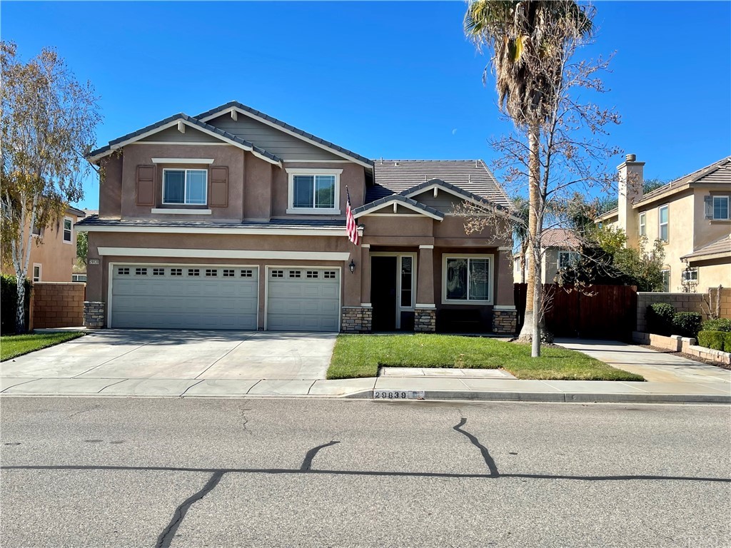 29839 Winter Hawk Road Menifee, CA 92586 - Photo 21 of 21 a front view of a house with a yard