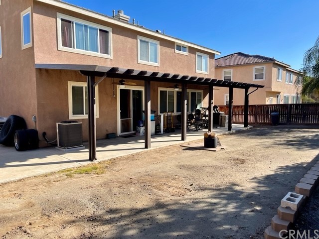 29839 Winter Hawk Road Menifee, CA 92586 - Photo 8 of 21 a view of a building with a patio