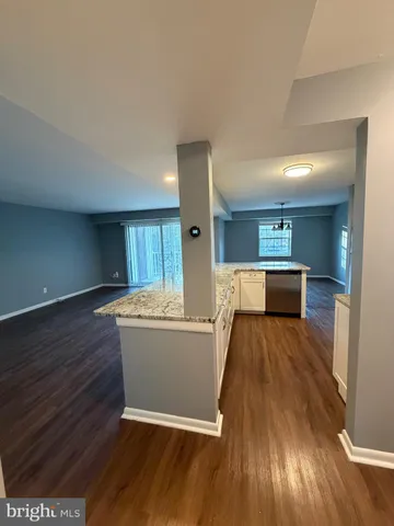 a view of kitchen with wooden floor