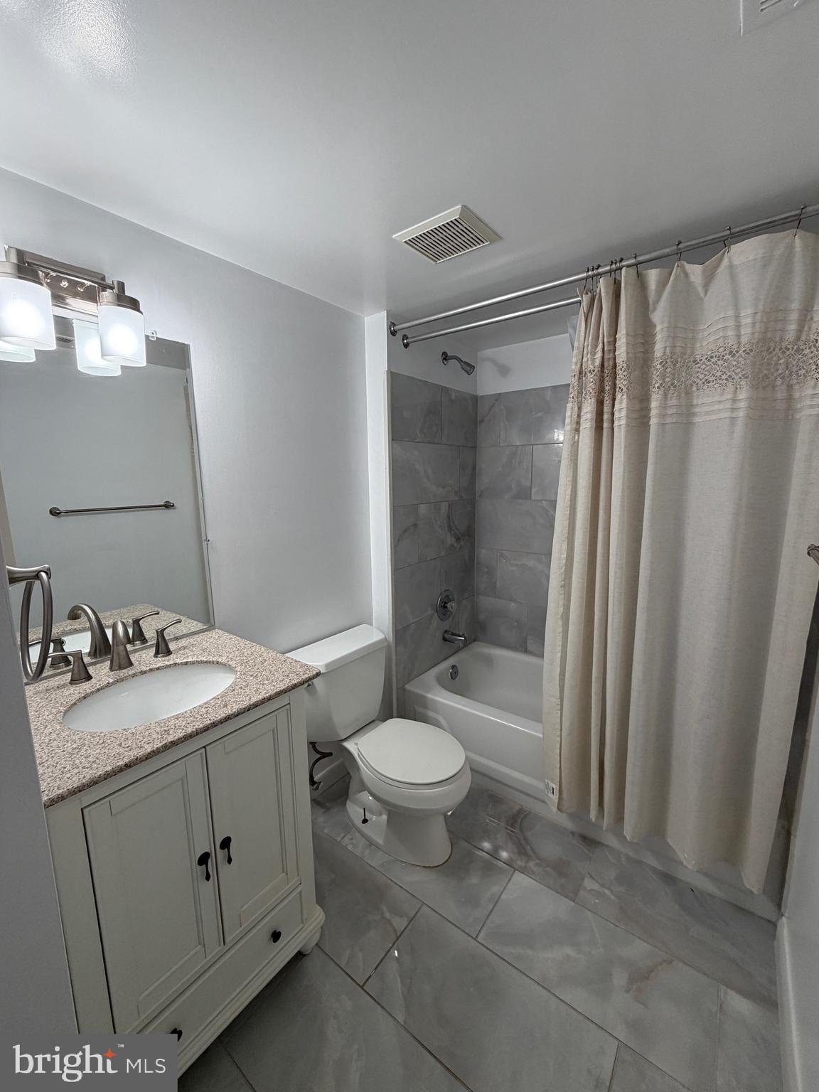 117 Castletown Road, Unit 302 Lutherville-Timonium, MD 21093 - Photo 9 of 15 a bathroom with a sink toilet and shower
