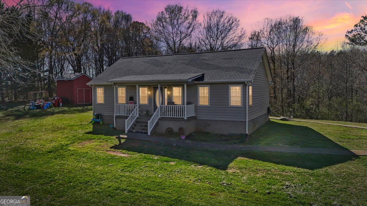 550 Stateline Road Bowdon, GA 30108 - Photo 1 of 1 a house view with a garden space