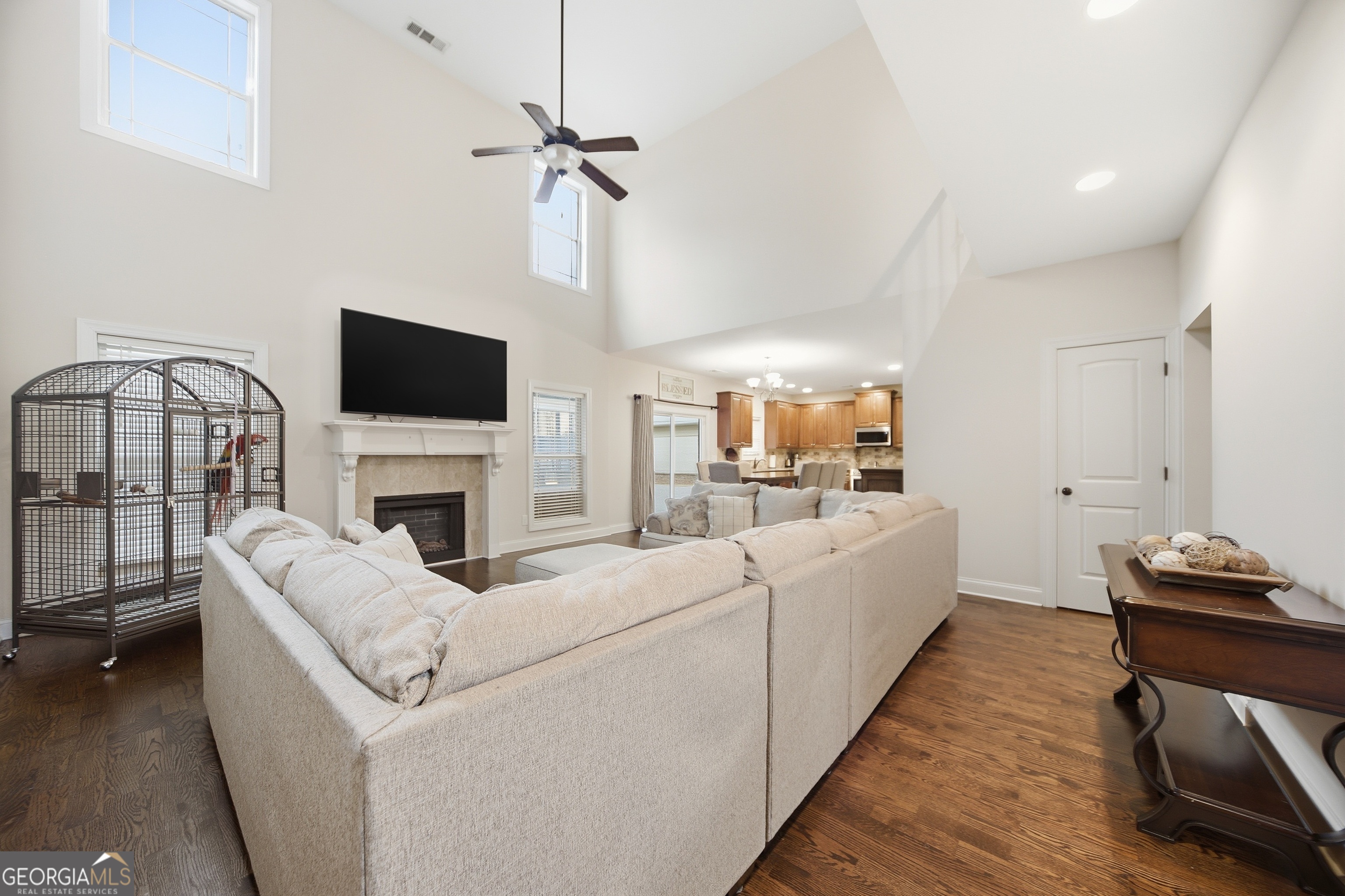 175 Rodgers Road McDonough, GA 30252 - Photo 12 of 84 a living room with furniture a fireplace and a flat screen tv