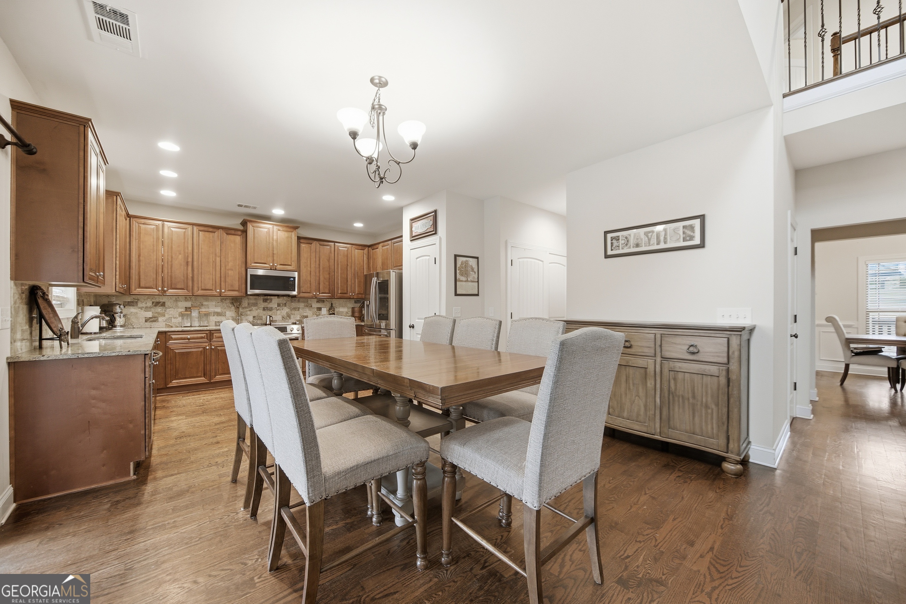 175 Rodgers Road McDonough, GA 30252 - Photo 19 of 84 a view of a dining room with furniture and wooden floor