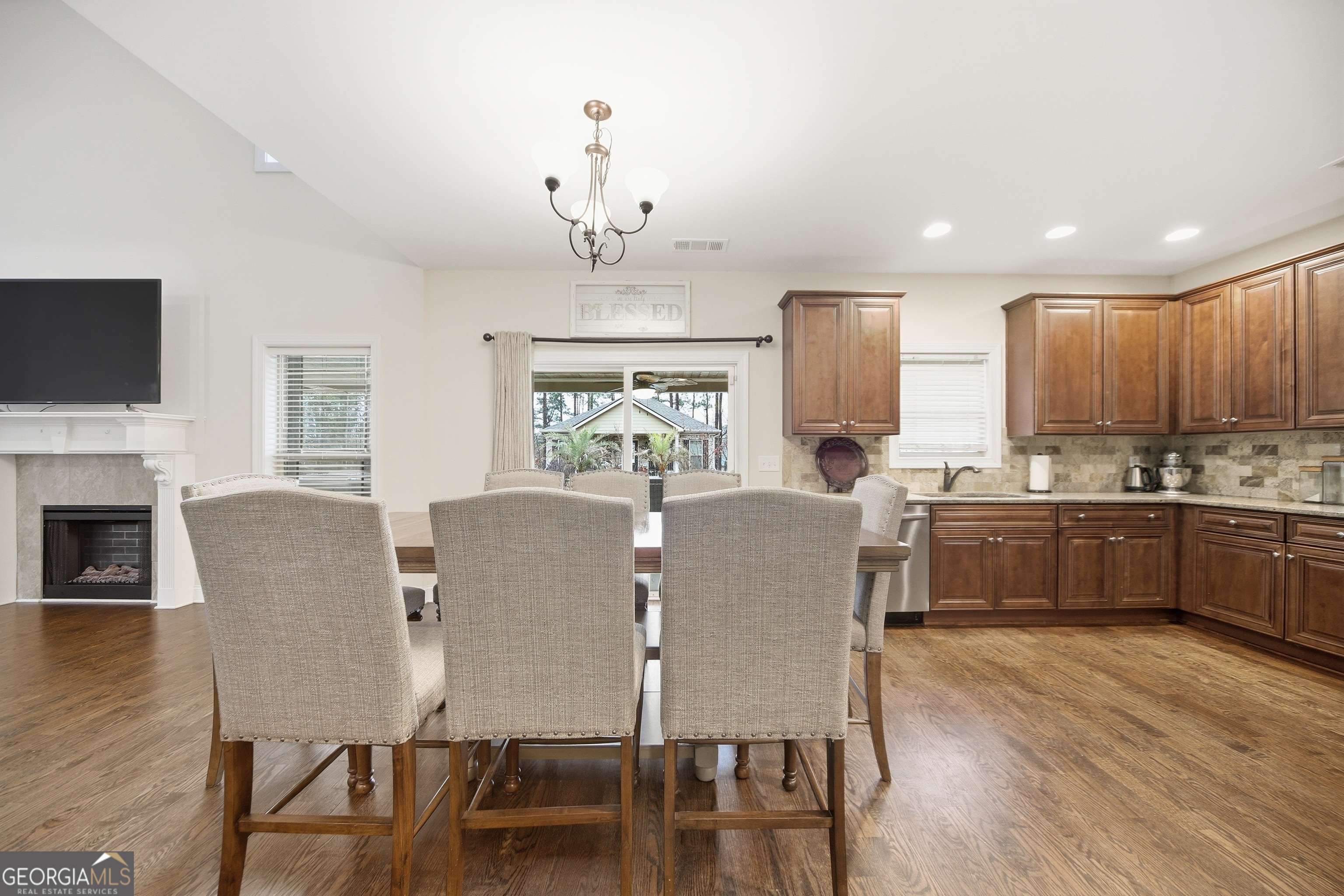 175 Rodgers Road McDonough, GA 30252 - Photo 22 of 84 a view of a dining room with furniture window and wooden floor