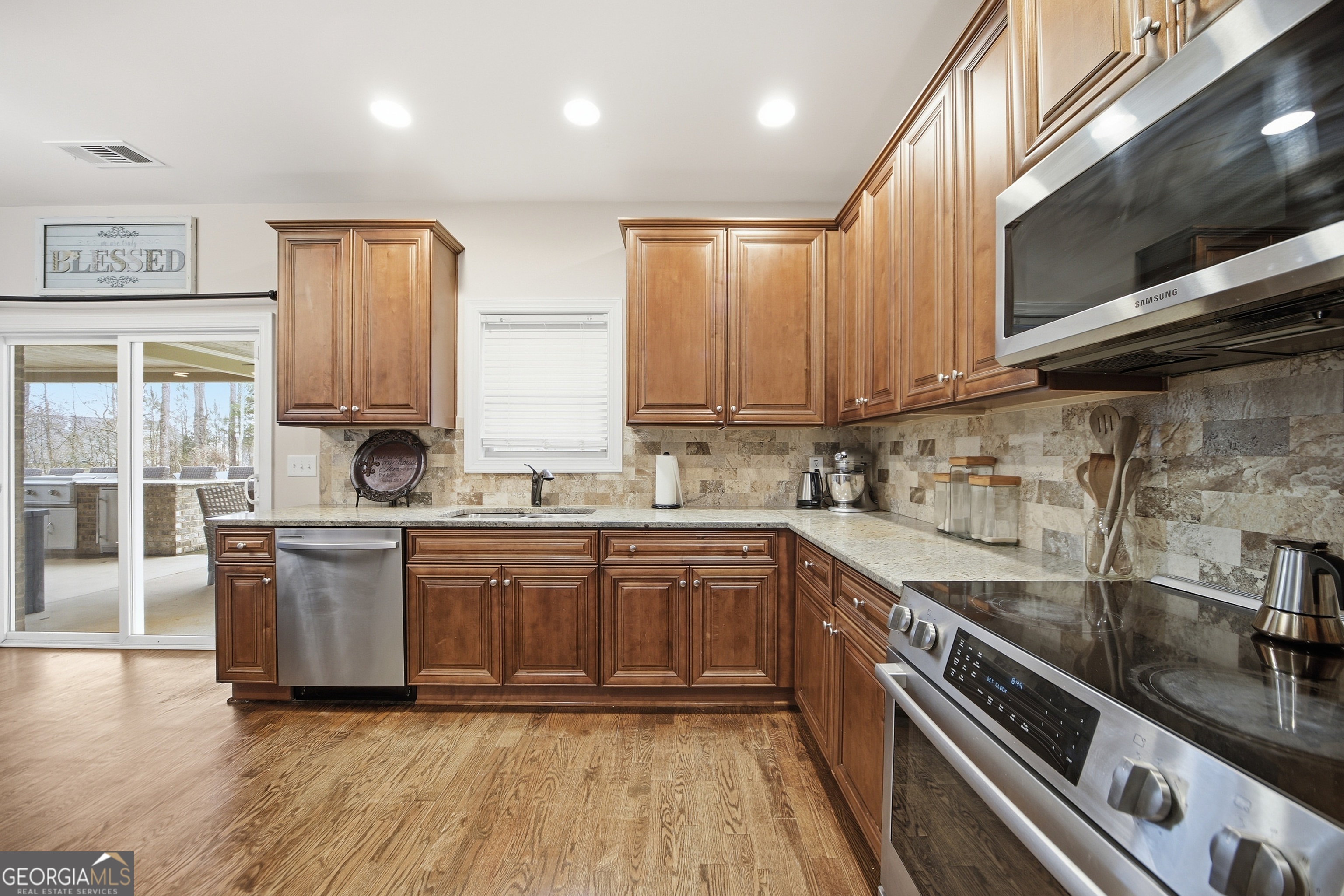 175 Rodgers Road McDonough, GA 30252 - Photo 27 of 84 a kitchen with a sink cabinets stainless steel appliances and a window