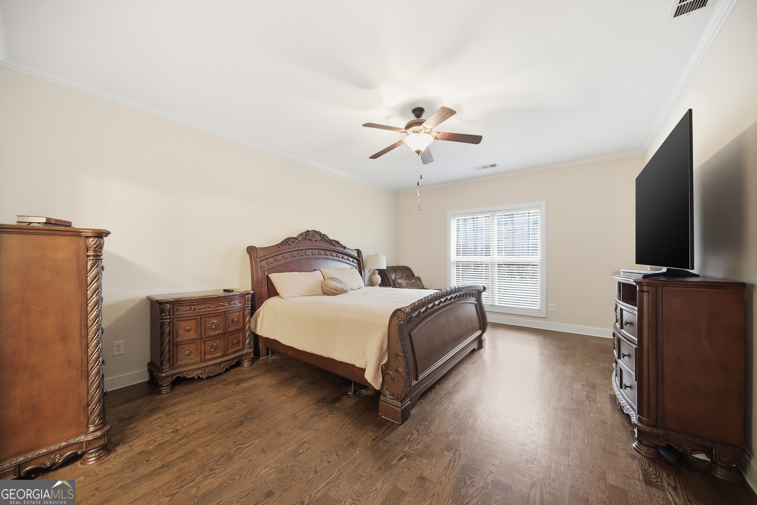 175 Rodgers Road McDonough, GA 30252 - Photo 32 of 84 a spacious bedroom with a bed and a flat screen tv