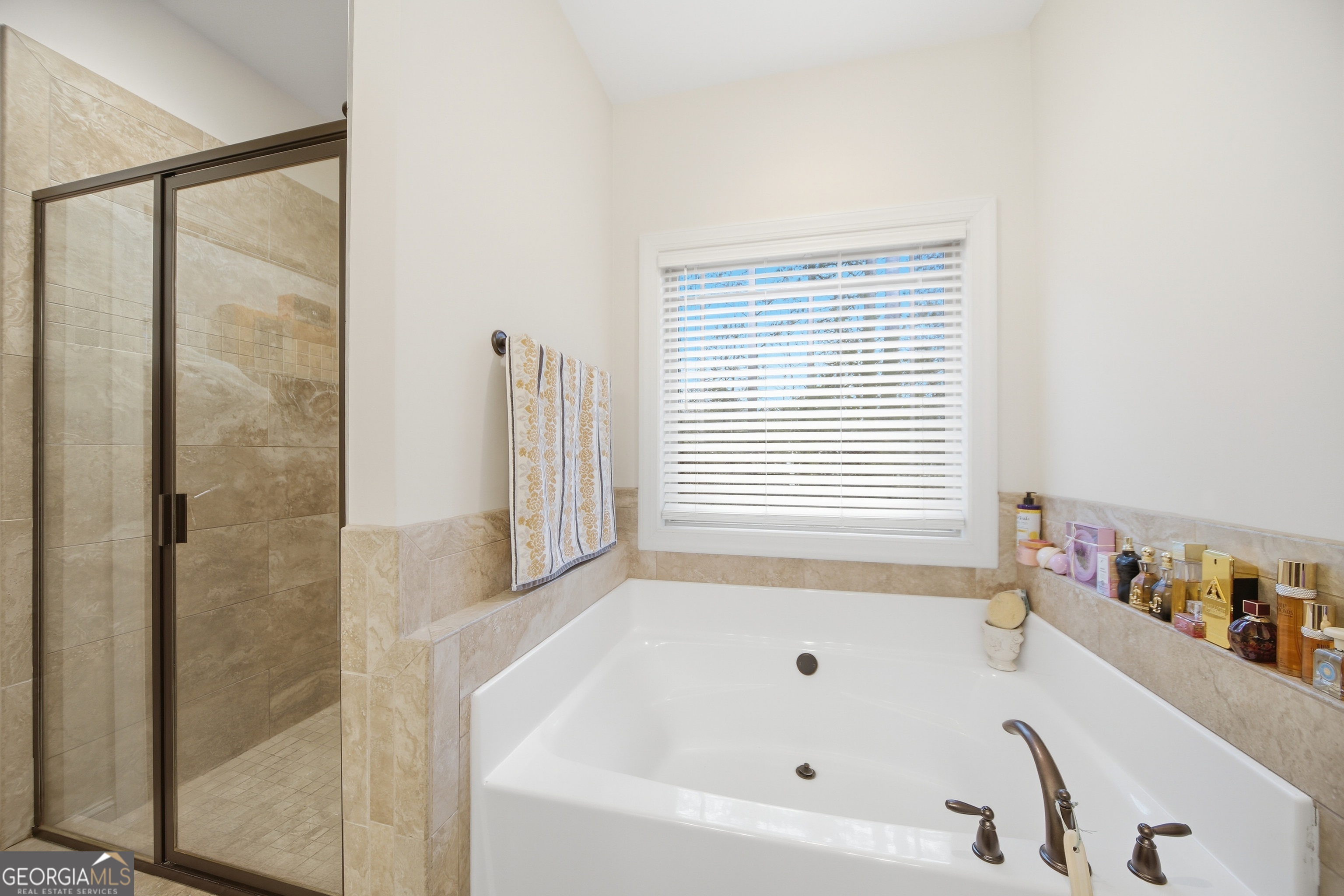 175 Rodgers Road McDonough, GA 30252 - Photo 36 of 84 a bathroom with a bathtub and a shower