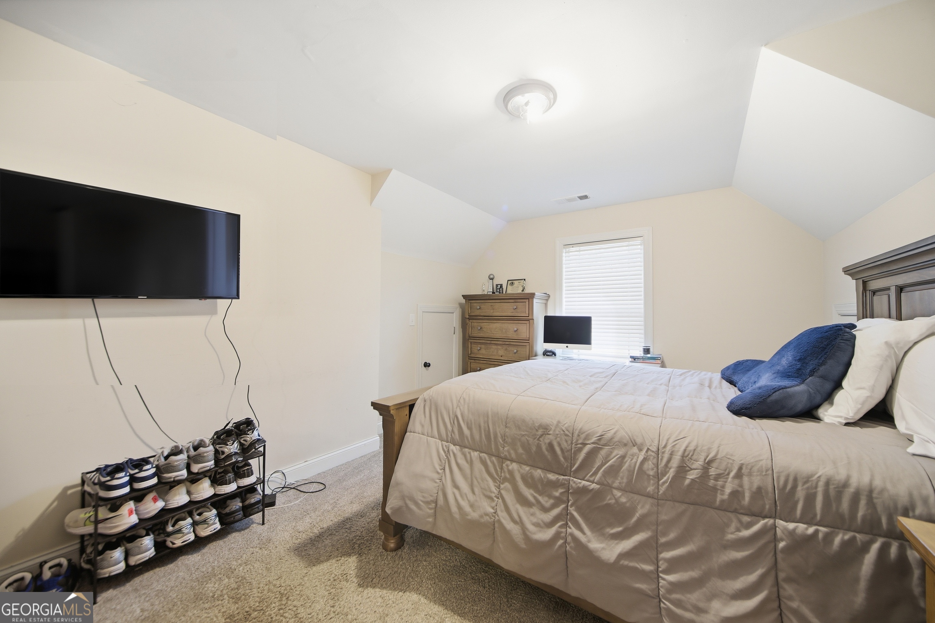 175 Rodgers Road McDonough, GA 30252 - Photo 43 of 84 a bedroom with a bed and a flat screen tv