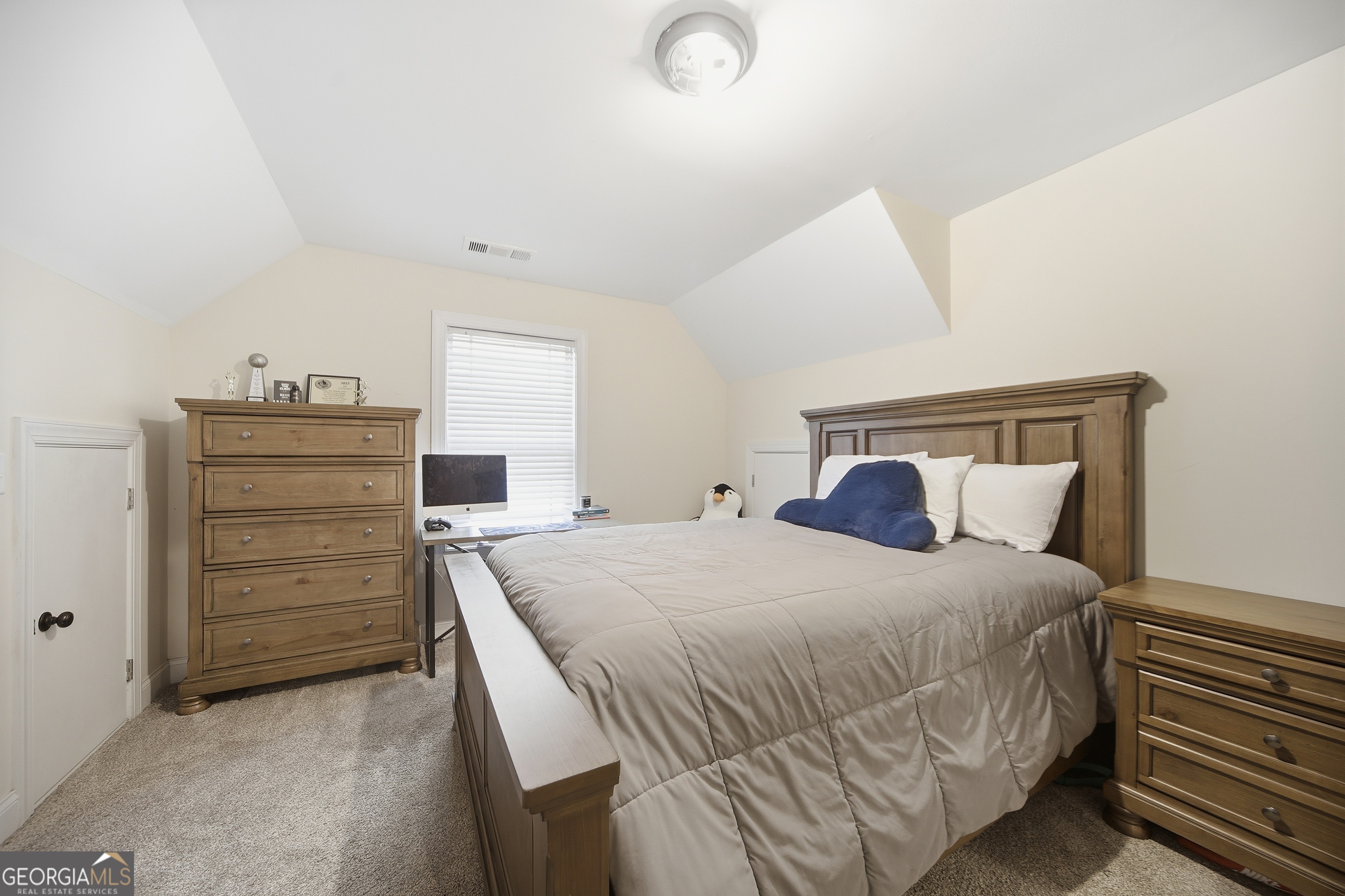 175 Rodgers Road McDonough, GA 30252 - Photo 45 of 84 a bedroom with a bed and a dresser