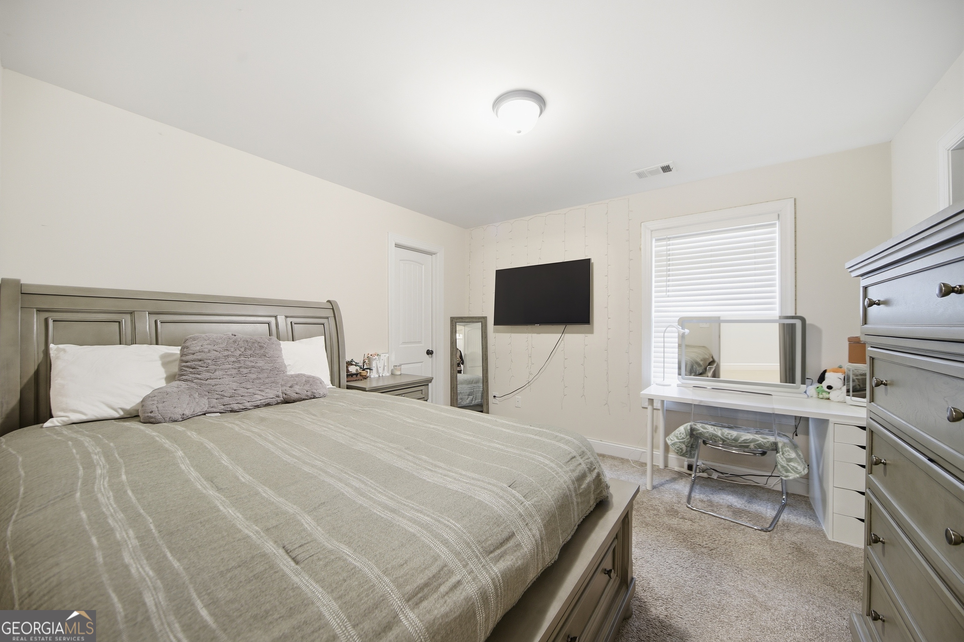 175 Rodgers Road McDonough, GA 30252 - Photo 47 of 84 a bedroom with a bed and a flat screen tv