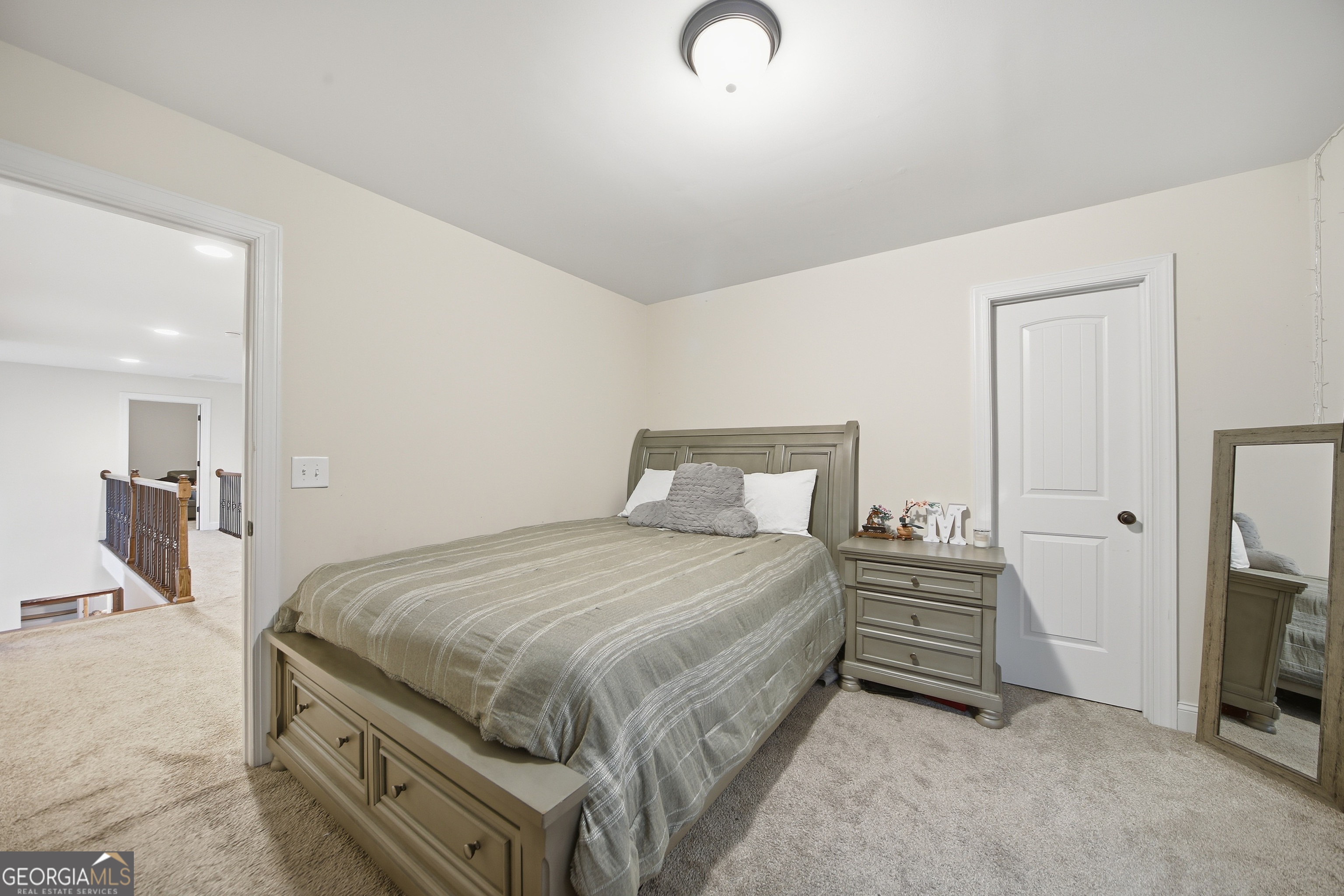 175 Rodgers Road McDonough, GA 30252 - Photo 48 of 84 a bedroom with a bed and a view of living room