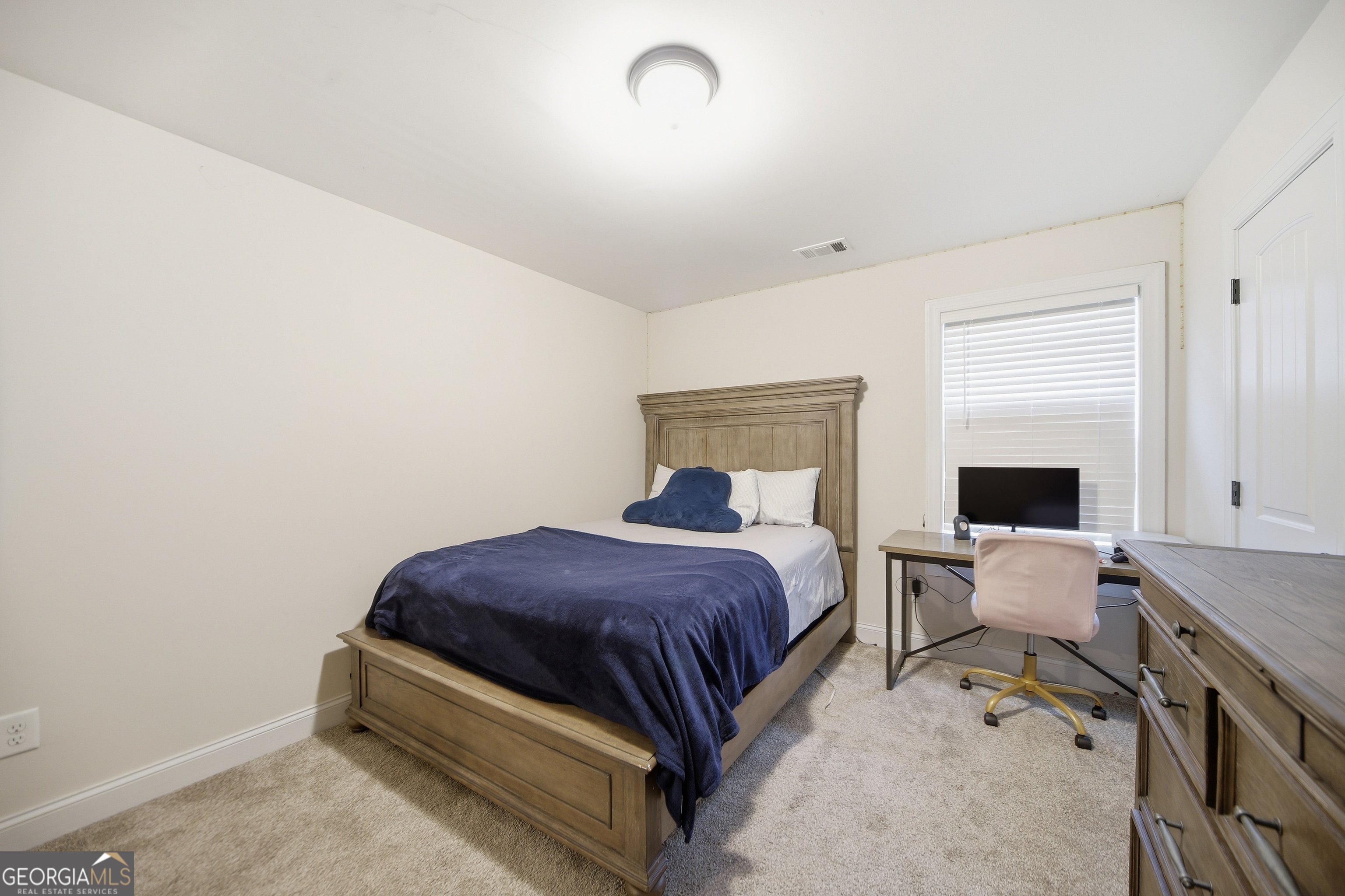 175 Rodgers Road McDonough, GA 30252 - Photo 52 of 84 a bedroom with a bed and a flat screen tv