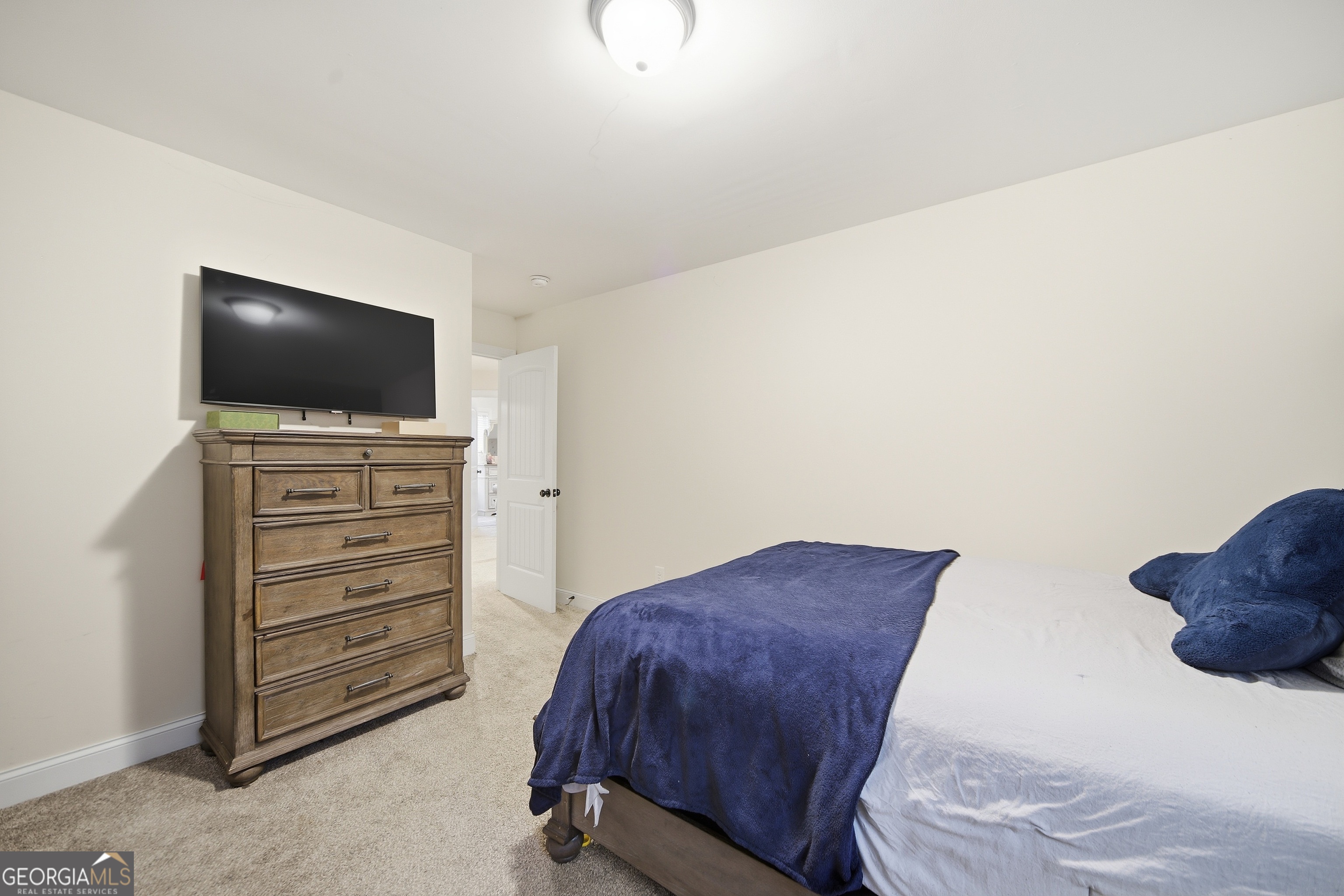 175 Rodgers Road McDonough, GA 30252 - Photo 53 of 84 a bedroom with a bed and flat screen tv