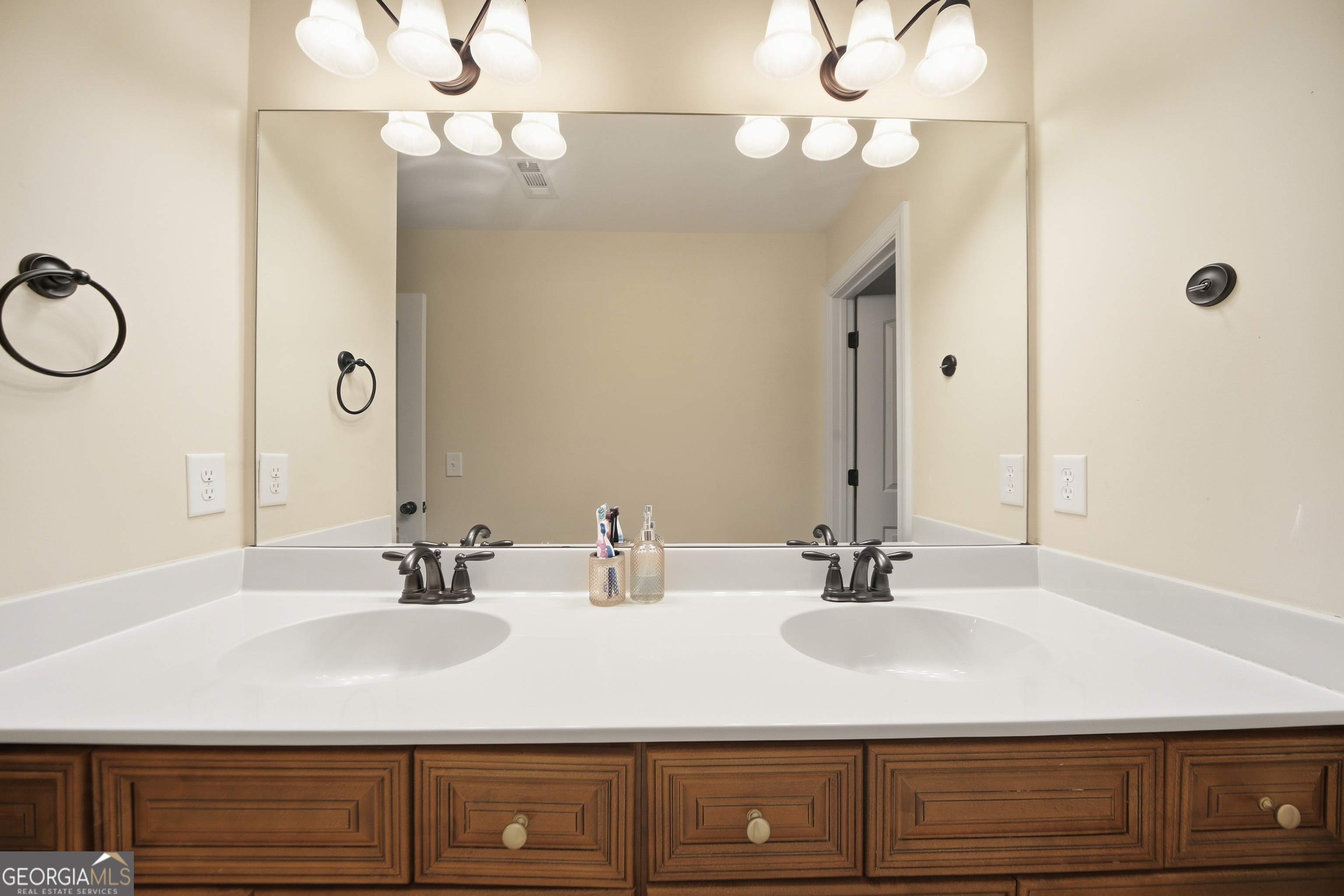 175 Rodgers Road McDonough, GA 30252 - Photo 55 of 84 a bathroom with a sink vanity and a mirror