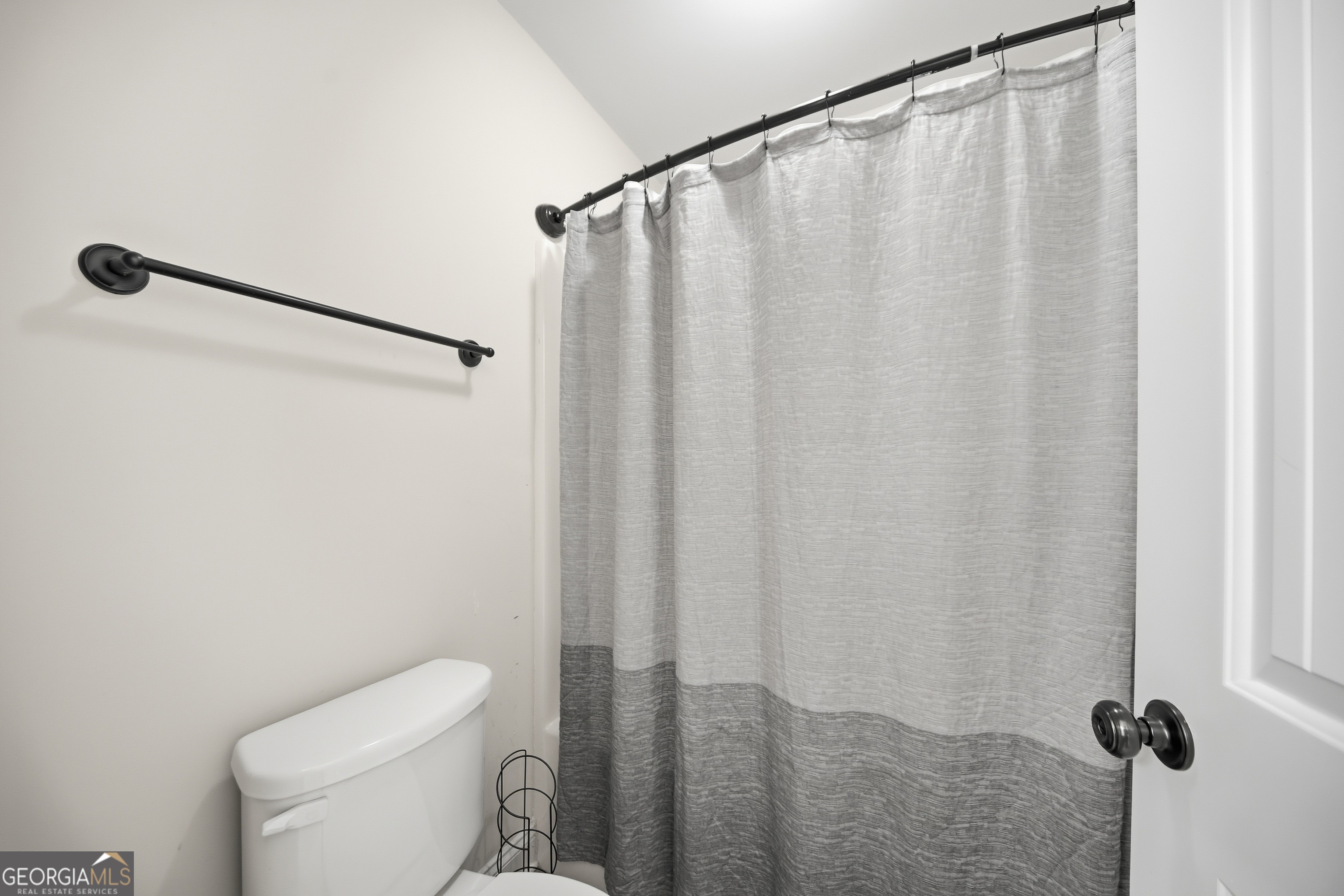 175 Rodgers Road McDonough, GA 30252 - Photo 56 of 84 a white toilet sitting next to a shower