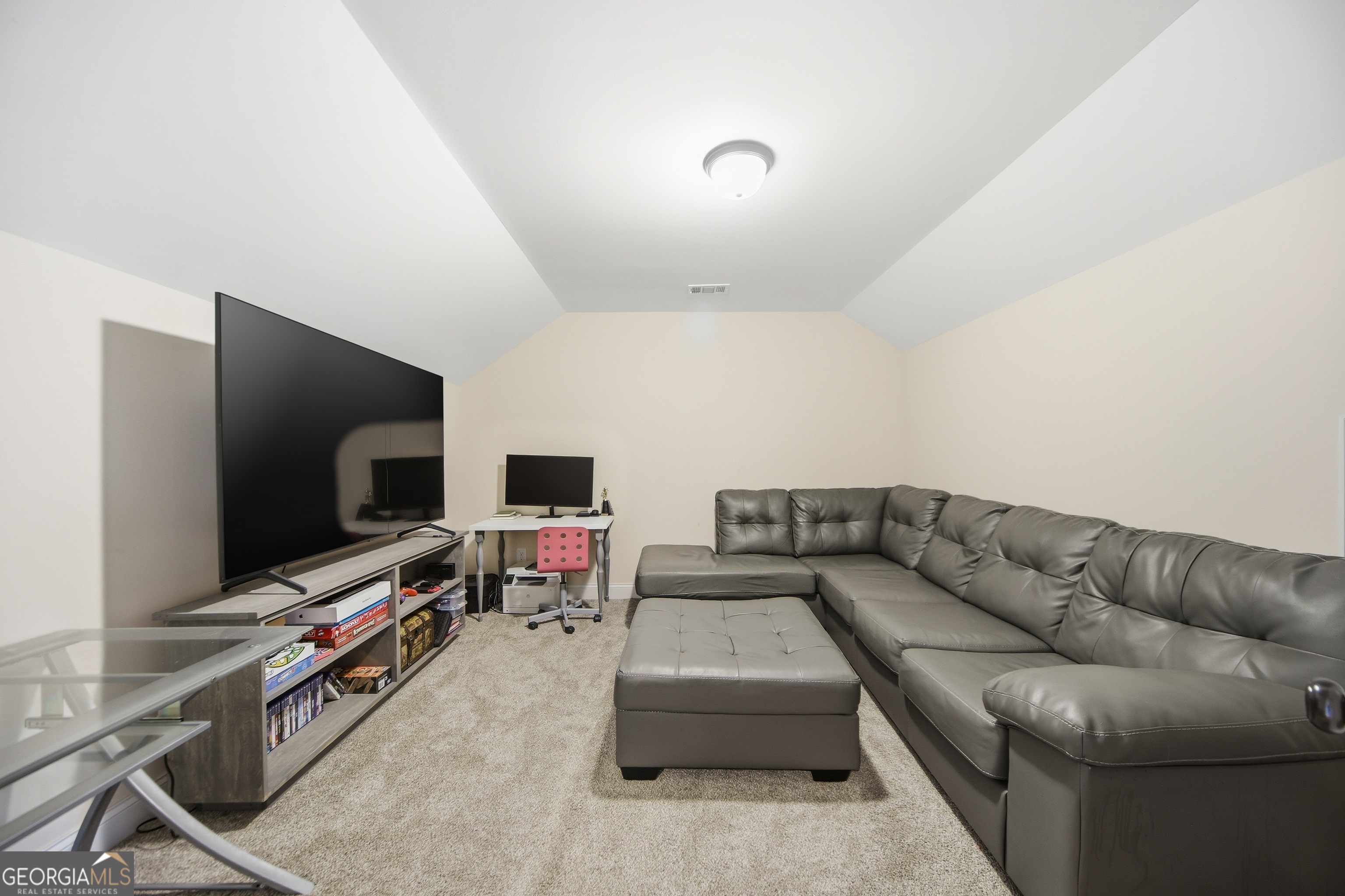 175 Rodgers Road McDonough, GA 30252 - Photo 57 of 84 a living room with furniture and a flat screen tv