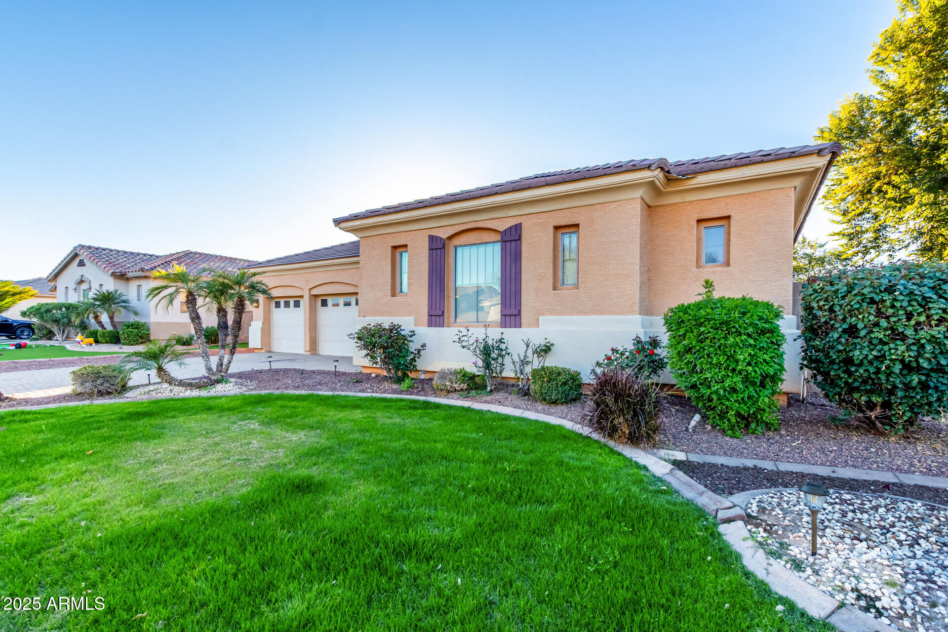 2668 South Stuart Avenue Gilbert, AZ 85295 - Photo 2 of 40 a front view of a house with garden