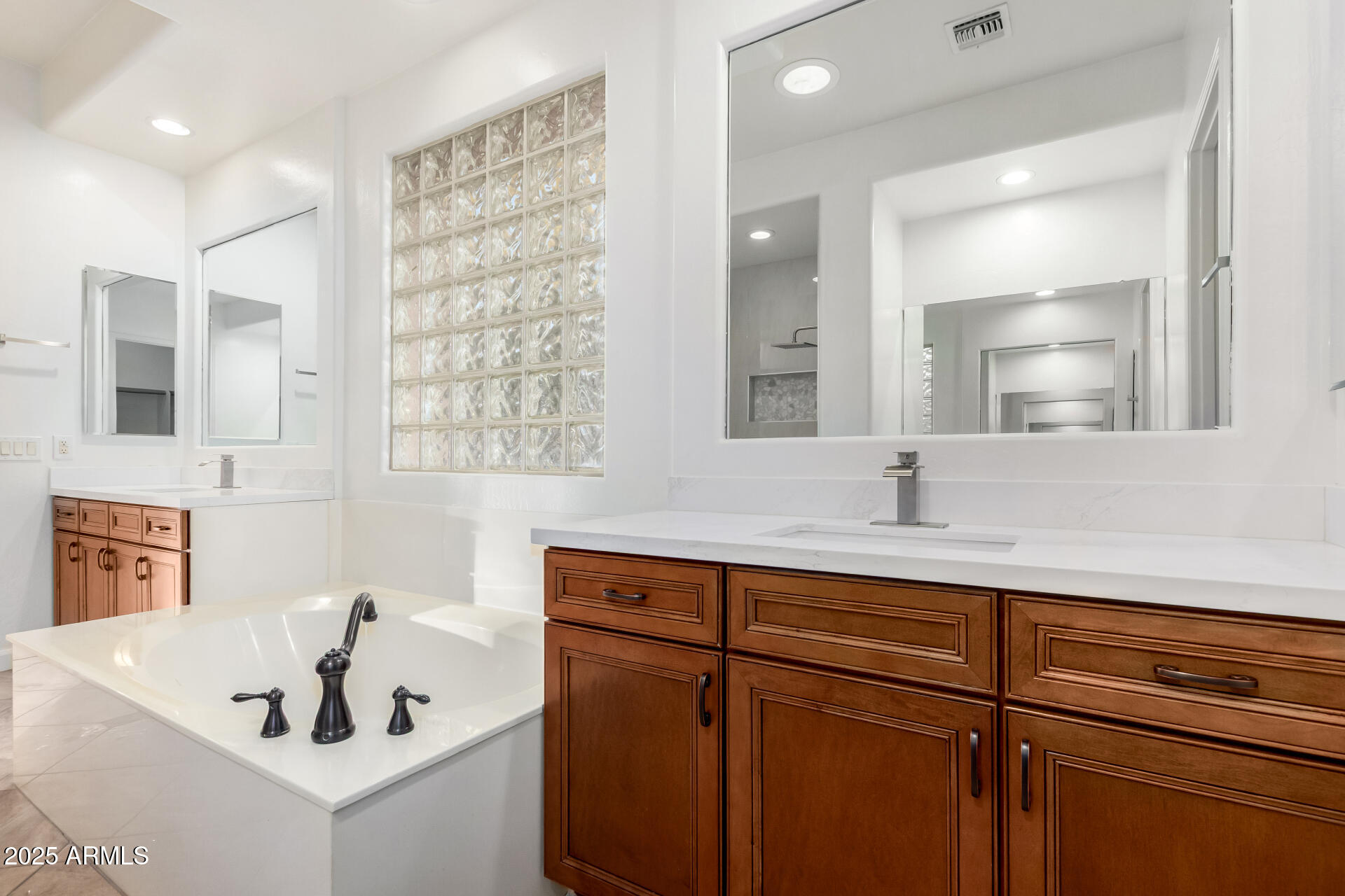 2668 South Stuart Avenue Gilbert, AZ 85295 - Photo 23 of 40 a bathroom with a sink and a mirror
