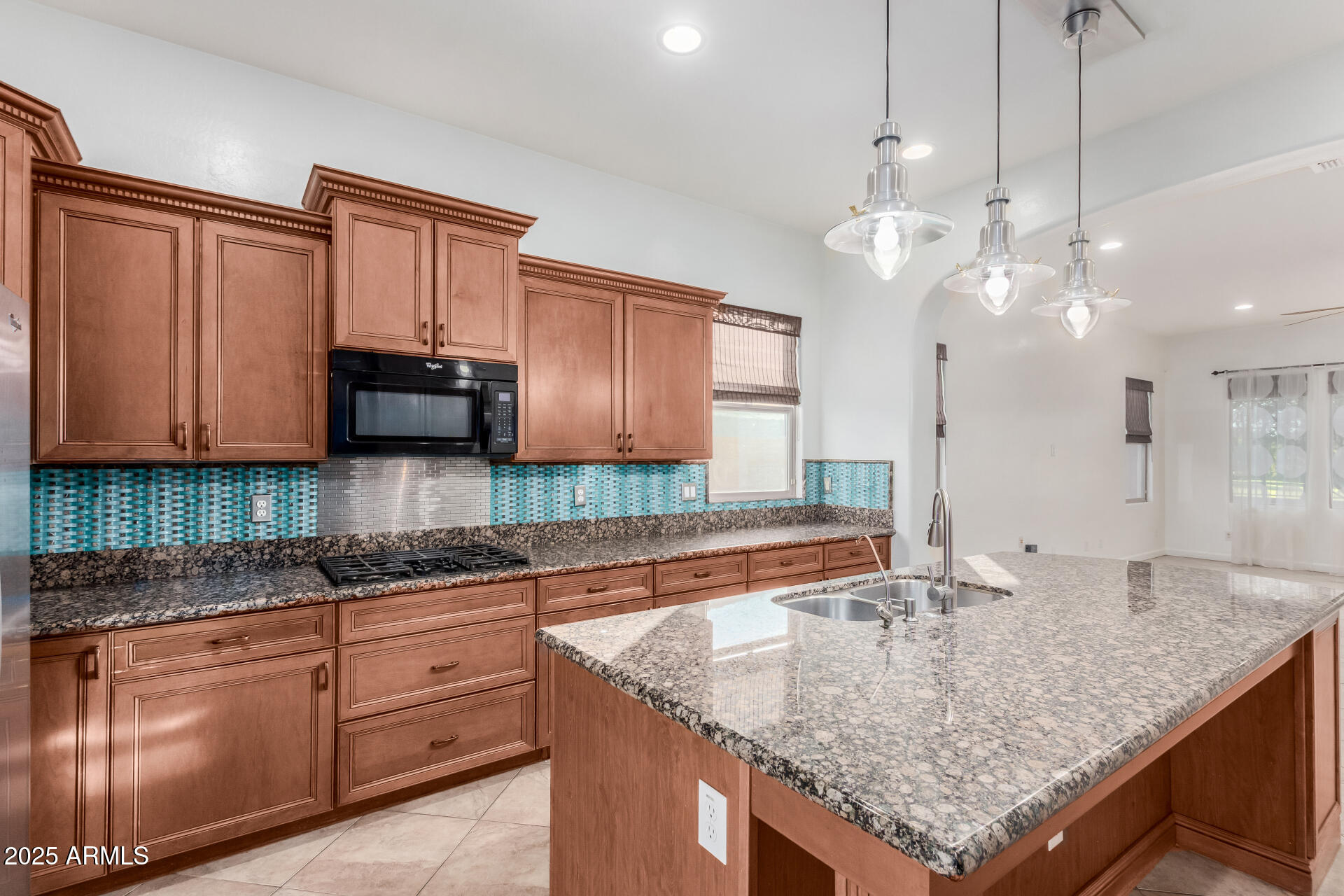 2668 South Stuart Avenue Gilbert, AZ 85295 - Photo 3 of 40 a kitchen with stainless steel appliances granite countertop a sink a oven and a granite counter tops
