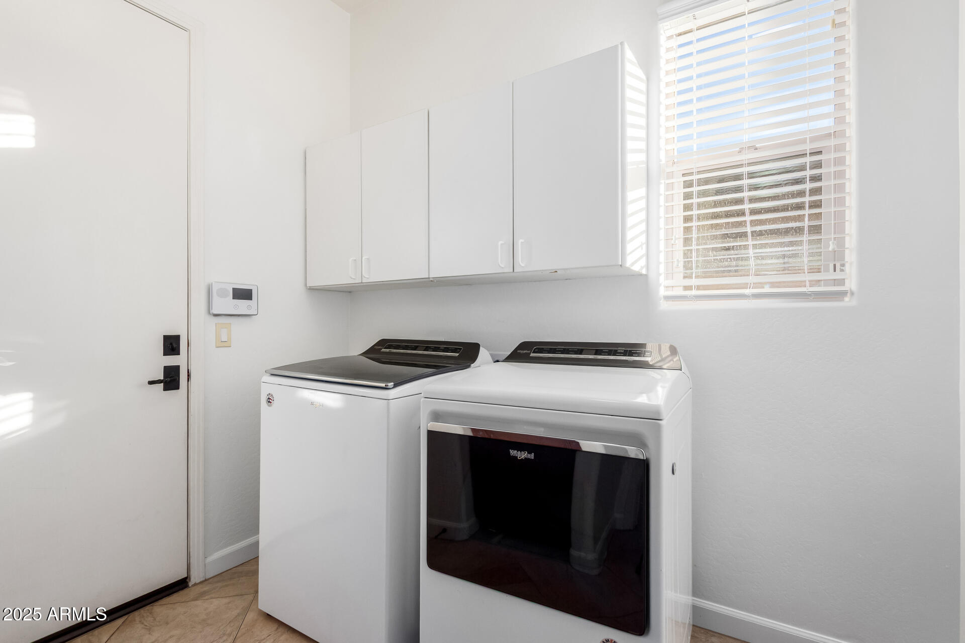2668 South Stuart Avenue Gilbert, AZ 85295 - Photo 34 of 40 a utility room with dryer and washer
