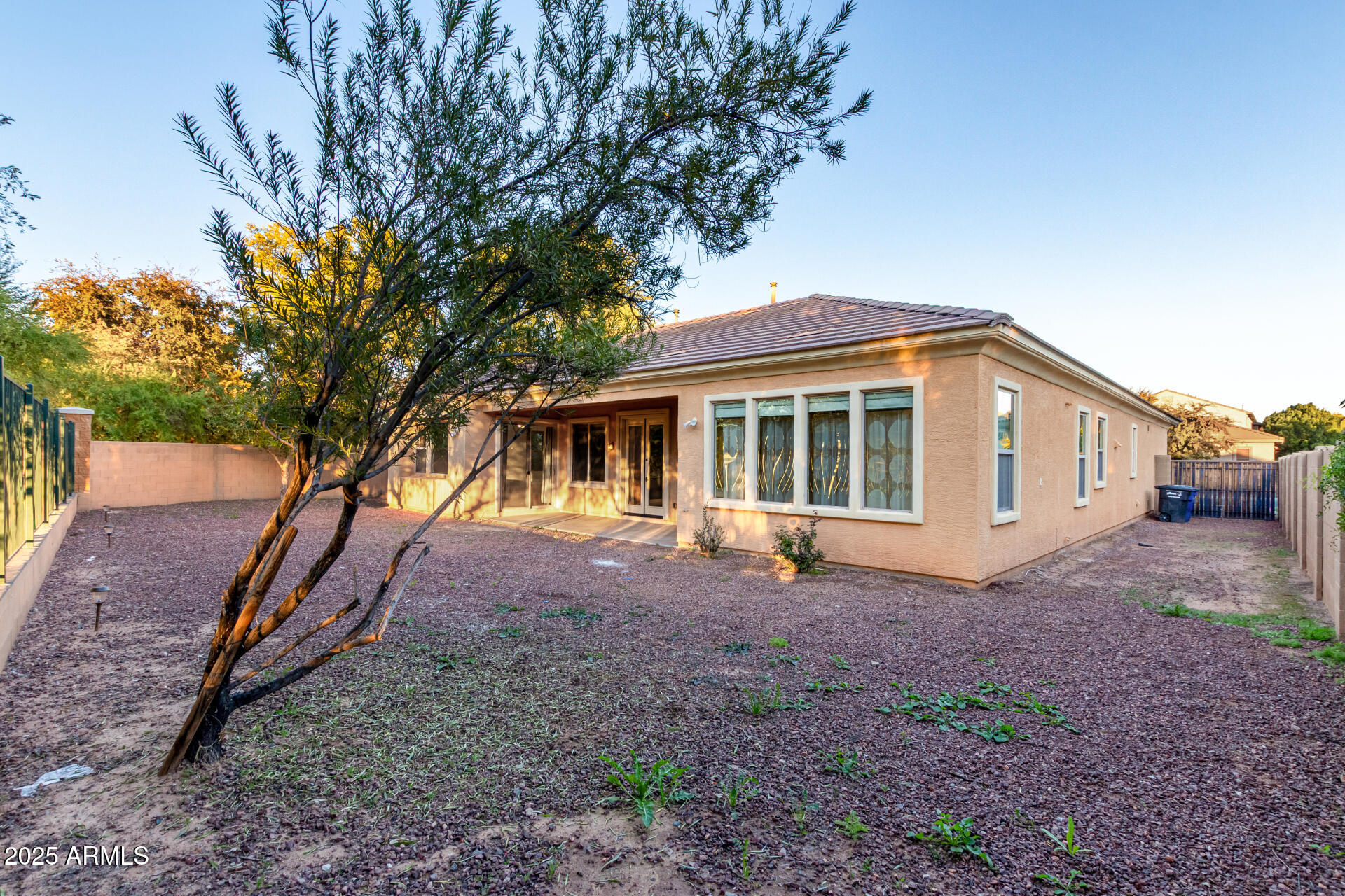 2668 South Stuart Avenue Gilbert, AZ 85295 - Photo 37 of 40 a view of house with backyard space and garden