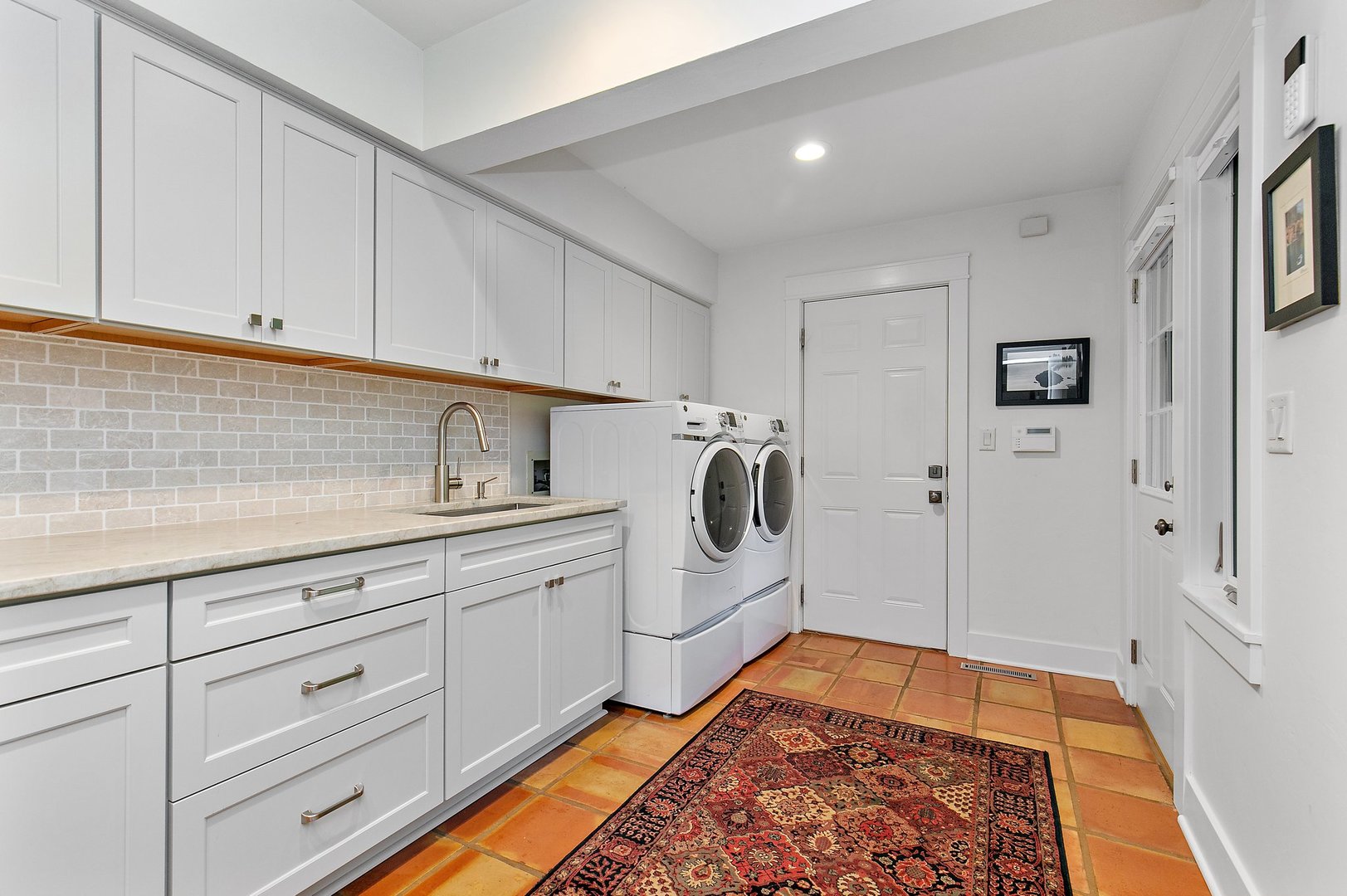 Undisclosed Address Woodstock, IL 60098 - Photo 29 of 40 a kitchen with white cabinets and white appliances