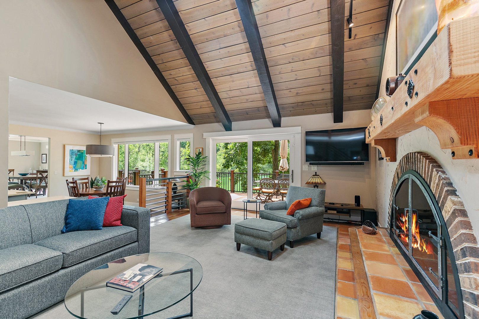 Undisclosed Address Woodstock, IL 60098 - Photo 10 of 40 a living room with furniture a fireplace and a flat screen tv